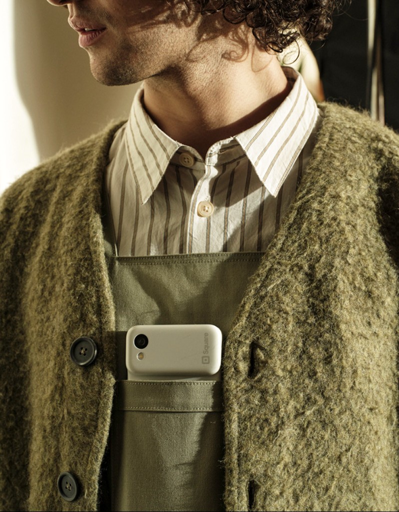 Square handheld lifestyle portrait with device in apron pocket